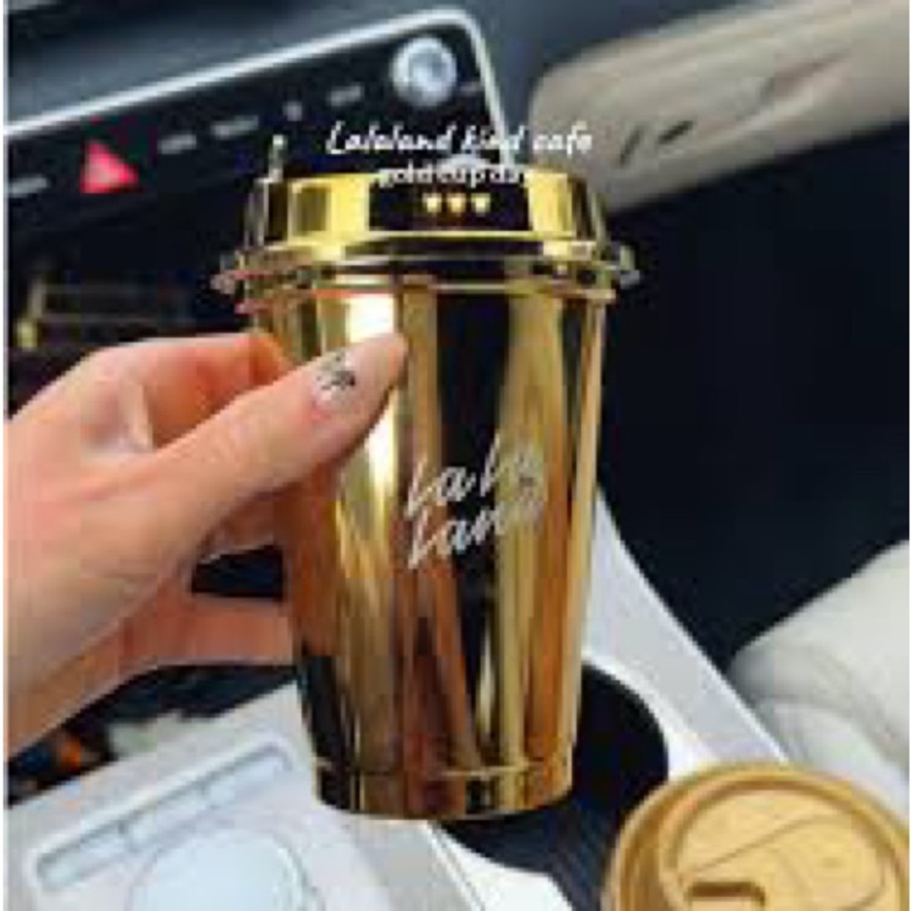 La la land kind cafe’s gold cup.